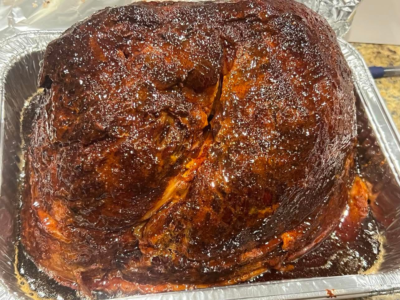 Whole bourbon glazed ham prepared by Coleman BBQ