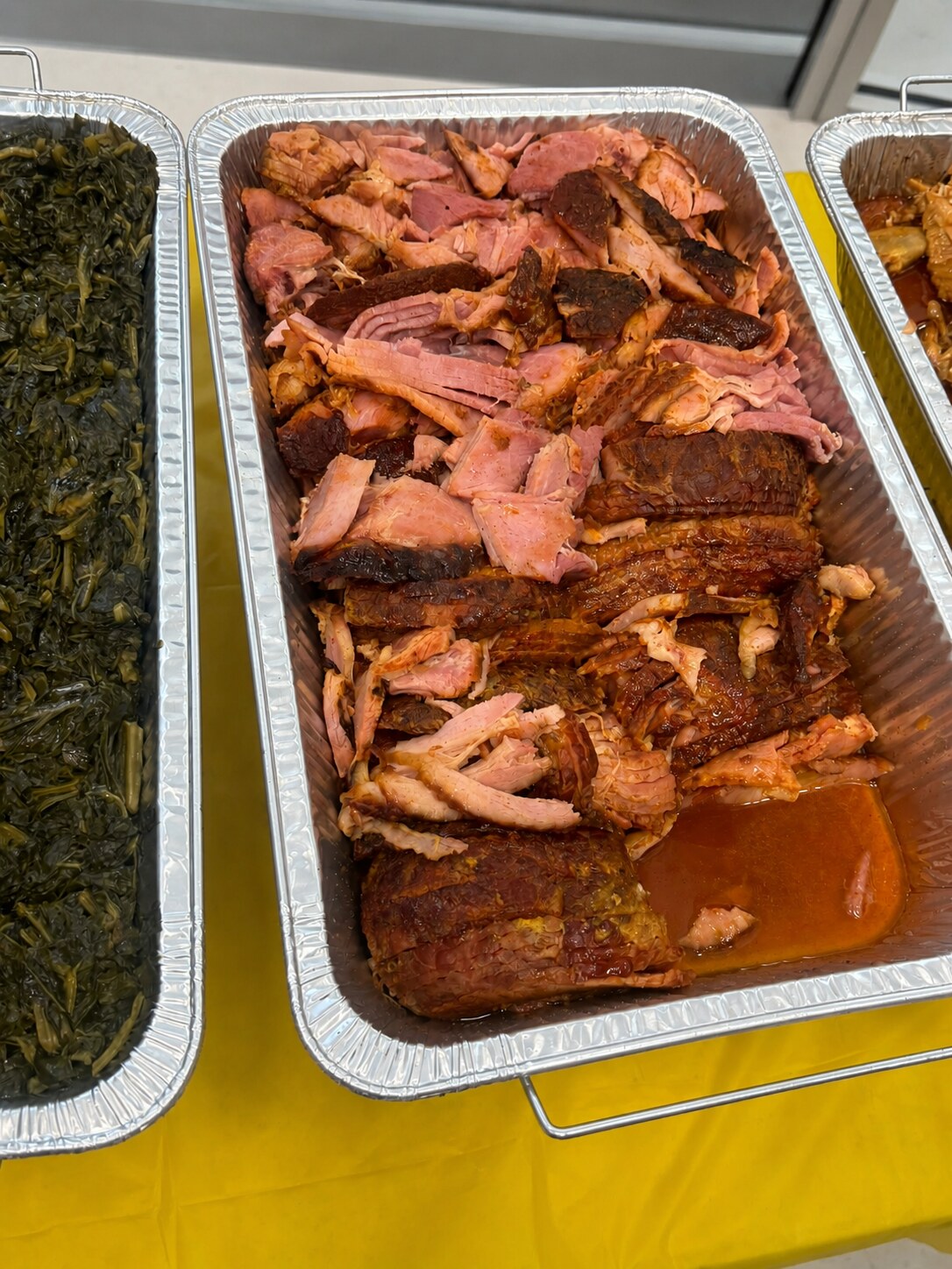 Glazed sliced ham in a catering tray