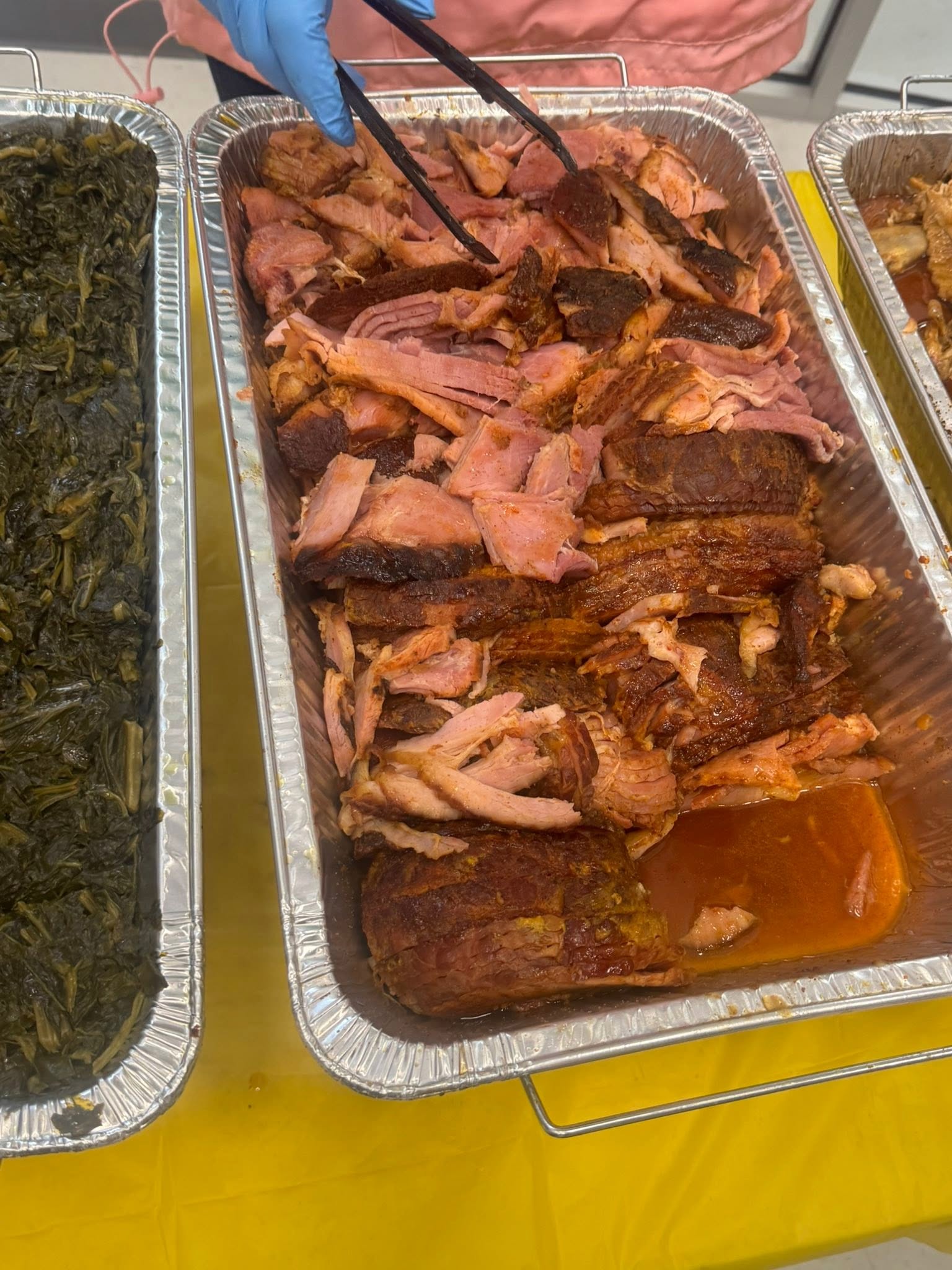 Sliced bourbon glazed ham prepared by Coleman BBQ