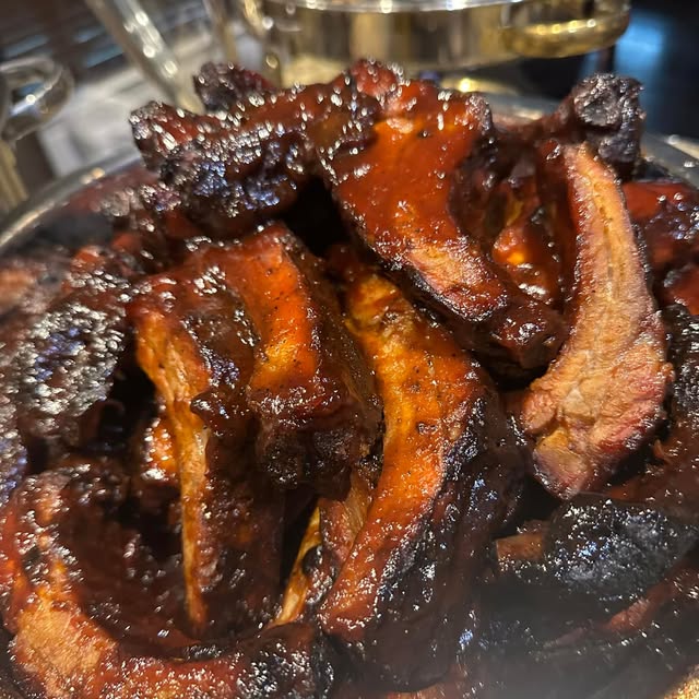 Glazed barbecue ribs with a dark caramelized bark