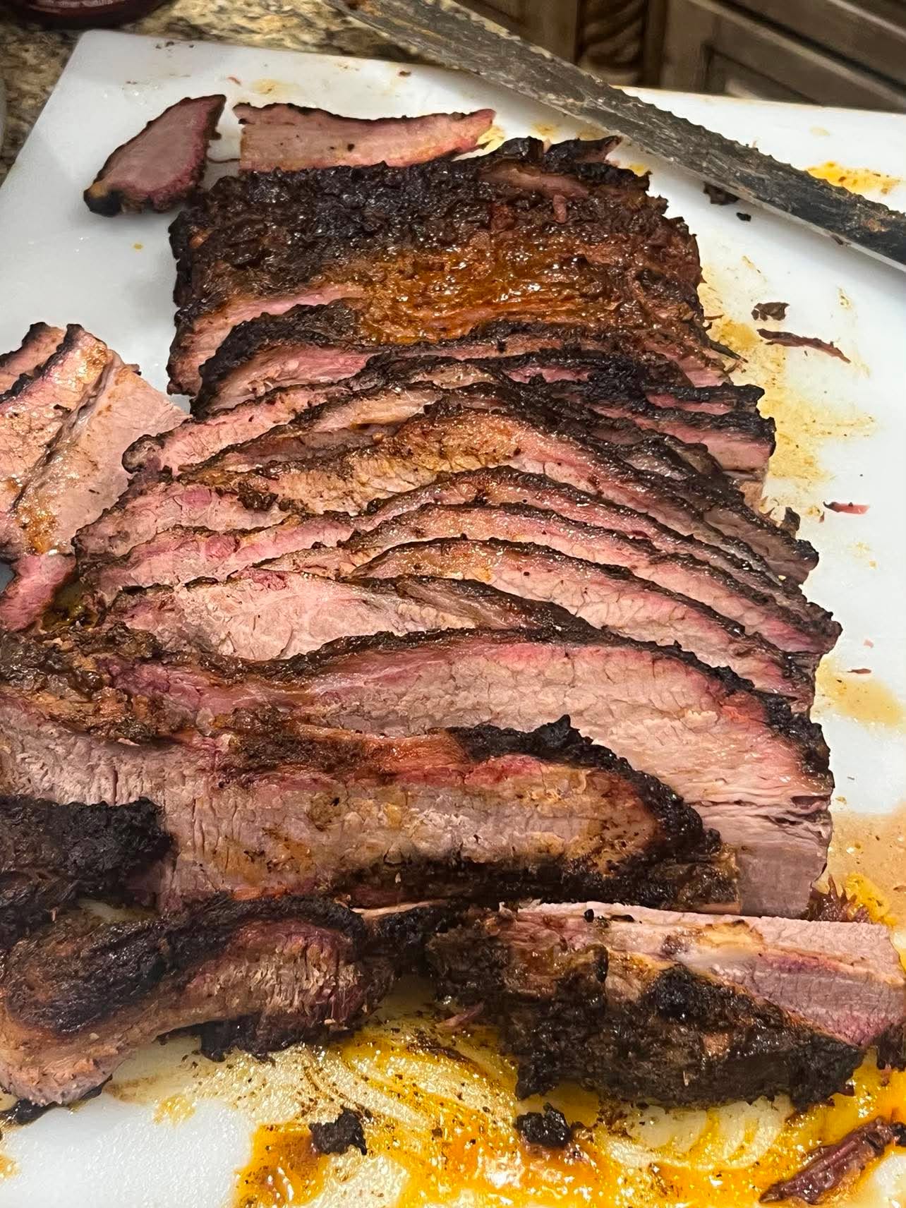 Sliced smoked brisket prepared by Coleman BBQ