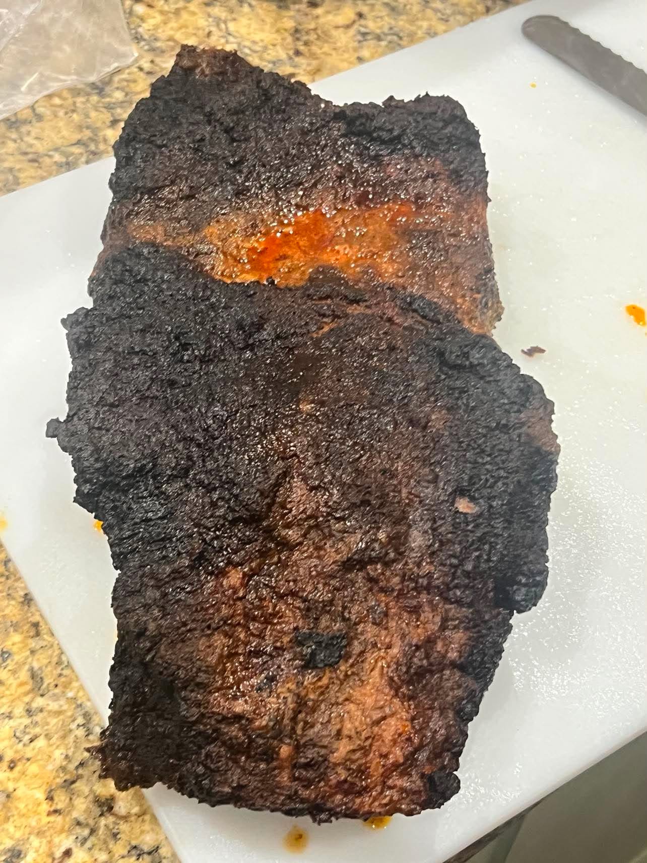 Whole smoked brisket prepared by Coleman BBQ